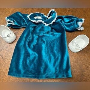 Cabbage patch kids turquoise velour dress, lace trim cuffs, collar. White shoes.